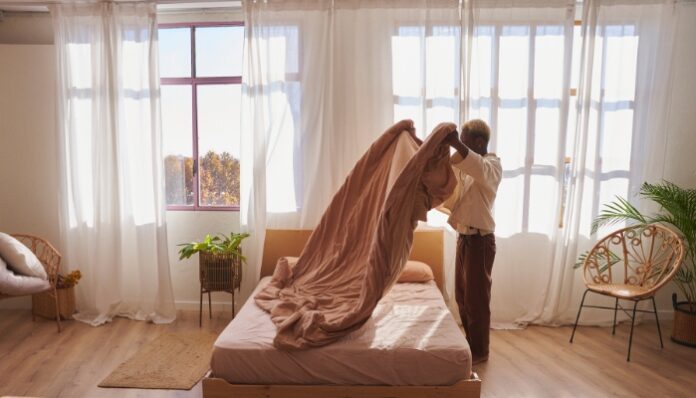 Mattress Cleaning Woman making her bed