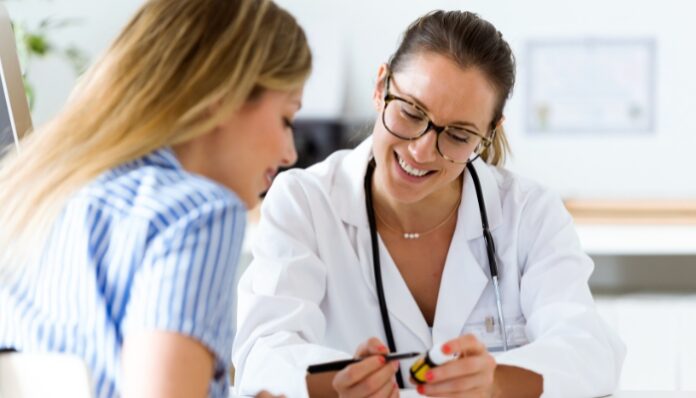 Postoperative Care Woman Getting Postoperative Care from Doctor