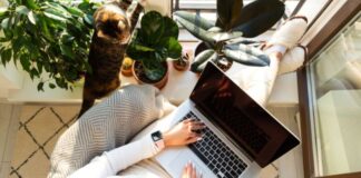 Woman Enjoying Imperfect House With Plants and Cat