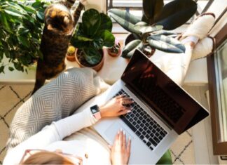 Woman Enjoying Imperfect House With Plants and Cat