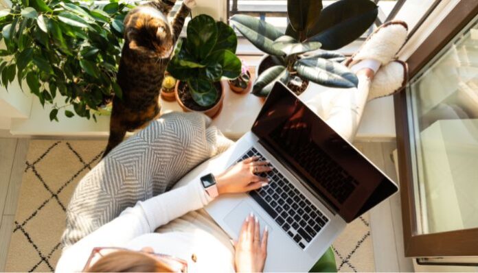 Woman Enjoying Imperfect House With Plants and Cat