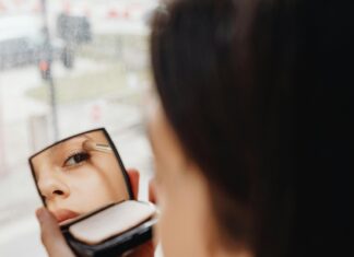 Spring 2025 Makeup Trends: What’s Cute & What’s Questionable Woman Putting on New Makeup During Spring Rain