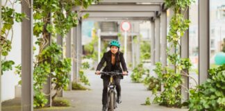 We Say We Care About the Planet — So Why Don’t We Live Like It? Woman Riding Bike to Help Environment