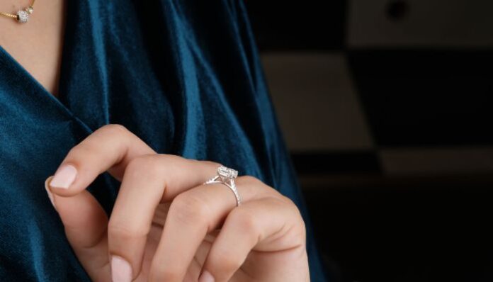 Diamond Solitaire Woman Wearing Single Diamond RIng