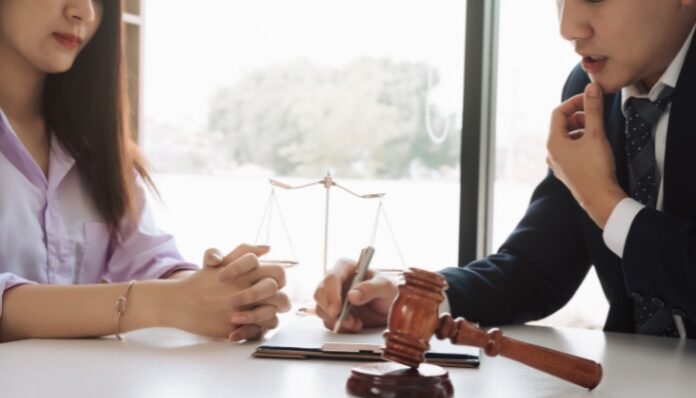 Sexual Harassment Case Woman Discussing Workplace Harassment with Attorney