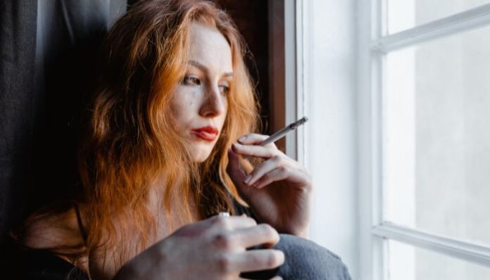 Woman Addiction Woman Smoking to Hide Addiction