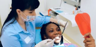 Hate Going To The Dentist? How To Overcome Dental Anxiety Woman Enjoying Visit With Dentist After Overcoming Dental Anxiety