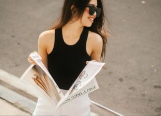 Beyond Blogging: Bratish Magazine as a Creative Hub for Lifestyle & Trends Woman Reading Magazine While Walking