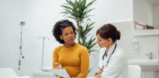 Differences Between State & Federal Malpractice Rules You Should Know Woman Talking to Doctor Who Made Malpractice Mistake