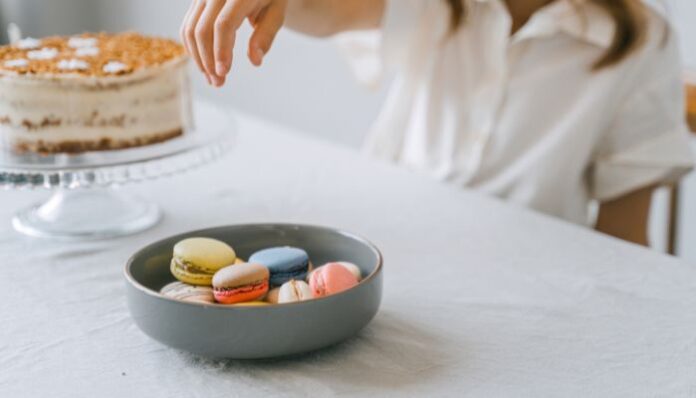 Macaron in Bowl Person Eating Colorful Macarons
