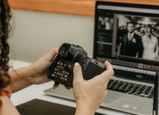 A Beginner’s Guide To Choosing The Best Action Camera Woman Making Photo Adjustments on Camera