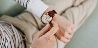 Man Adjusting Time on Luxury Watch