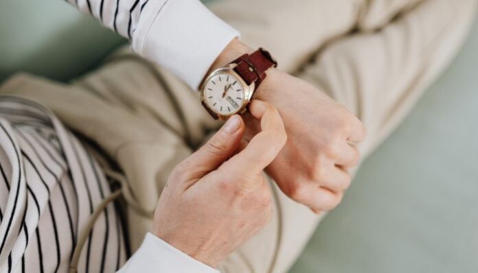Luxury Watch Man Adjusting Time on Luxury Watch