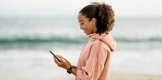 woman on Tiktok on phone smiling