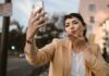 Woman Blowing Kiss on Video Call With Friend to Celebrate Special Day Long Distance