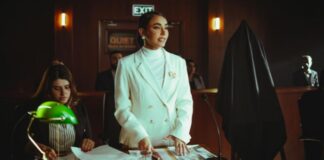 Woman Standing Up in Court Room