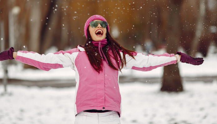 Woman in winter sports clothes looking at camera