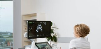 What Your Body Might Be Telling You Before You Even Notice Symptoms Woman performing ultrasound after patient noticed body signals of pregnancy