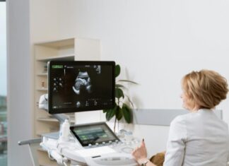 What Your Body Might Be Telling You Before You Even Notice Symptoms Woman performing ultrasound after patient noticed body signals of pregnancy