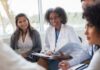 Group of Healthcare Workers Meeting With Specialist