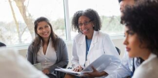 Group of Healthcare Workers Meeting With Specialist