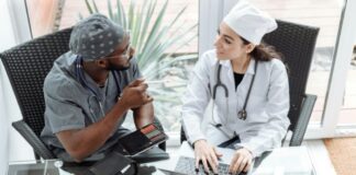How Modern Healthcare Services Are Becoming More Personalized Two doctors talking through treatment plan for personalized medical care