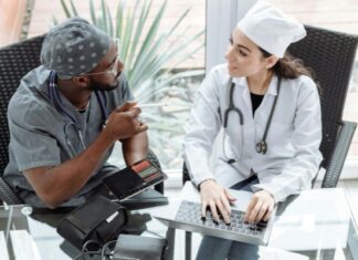 How Modern Healthcare Services Are Becoming More Personalized Two doctors talking through treatment plan for personalized medical care
