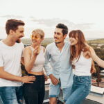 Group of friends enjoying outdoors at roof