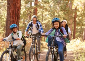 A Parent’s Guide To Safe & Fun Outdoor Adventures Mixed Race Family Riding Bikes in California Forest