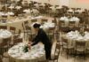 Woman wearing all black setting up event