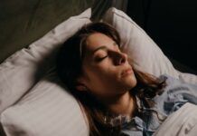 Woman Enjoying Restful Sleep With Comfy Pillows