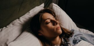 Woman Enjoying Restful Sleep With Comfy Pillows