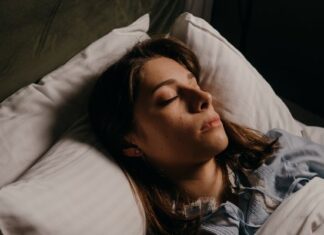 5 Steps to Finding The Perfect Bed for Better Sleep Woman Enjoying Restful Sleep With Comfy Pillows