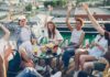 Group of young coworkers celebrating with after hours event