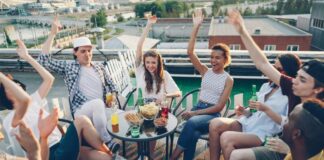 Group of young coworkers celebrating with after hours event