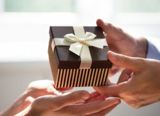 Why Gift Registries Make Gift-Giving Easier for Everyone Man Giving Gift to Woman for Special Occasion Picked From Her Gift Registry