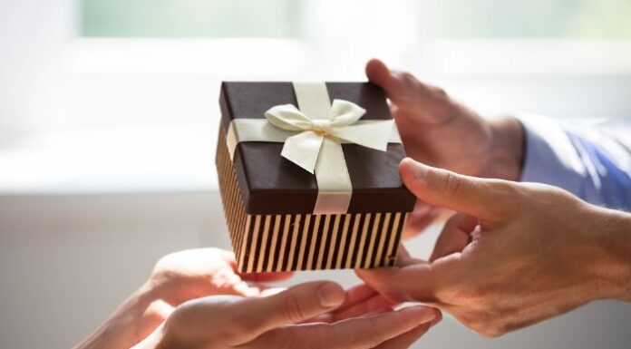 Man Giving Gift to Woman for Special Occasion Picked From Her Gift Registry