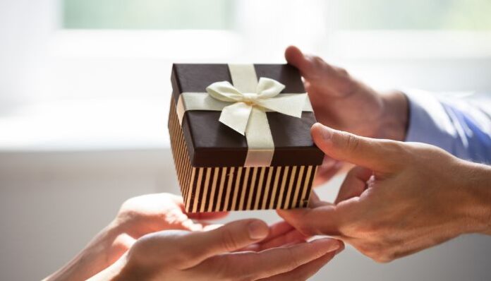 Man Giving Gift to Woman for Special Occasion Picked From Her Gift Registry