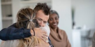 Man and Woman Embracing After Addiction Treatment