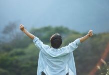 How Can I Grow Without Losing The Softest Parts Of Myself? Person Celebrating Growth and Accomplishment Outdoors