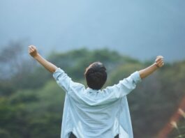How Can I Grow Without Losing The Softest Parts Of Myself? Person Celebrating Growth and Accomplishment Outdoors