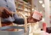 What I Wish I Knew Before Buying Expensive Skin Care Woman buying skincare products from beauty store