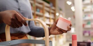 Woman buying skincare products from beauty store