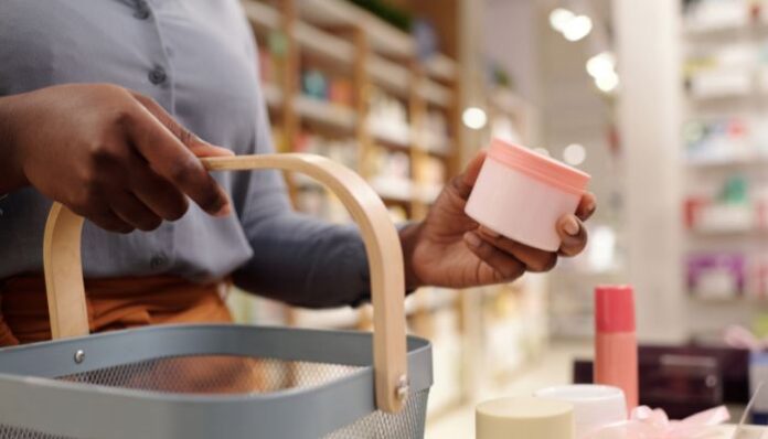 Woman buying skincare products from beauty store