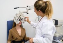 I Thought My Tired Eyes Were Normal Until My Routine Suffered Female Optometrist giving a young woman an eye exam to test for vision problems