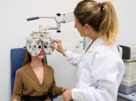 I Thought My Tired Eyes Were Normal Until My Routine Suffered Female Optometrist giving a young woman an eye exam to test for vision problems