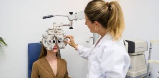 I Thought My Tired Eyes Were Normal Until My Routine Suffered Female Optometrist giving a young woman an eye exam to test for vision problems