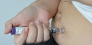 What First Time Users Should Know About Mounjaro Side Effects Person using Mounjaro GLP-1 and injecting into abdomen