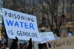 Poisoning_water_is_genocide_-_Stand_with_Standing_Rock-1