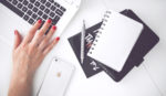 woman-hand-smartphone-desk